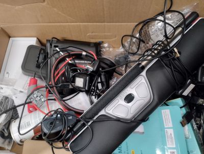 a box full of electronic devices and wires in it