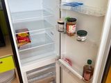 a refrigerator with its door open in a kitchen