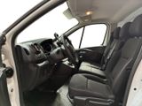 the interior of a car with the door open and the driver ' s seat down