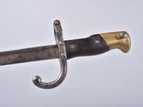 a close up of a sword on a white background