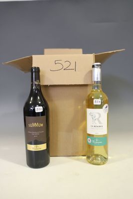 two bottles of wine sitting next to each other on a table