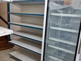 empty shelves in a store with empty shelves in the background