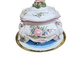 an image of a fancy tureeny dish with a rose on top