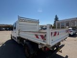 a white truck that is parked in the parking lot