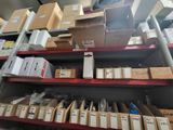 boxes and boxes are stacked on a shelf in a store