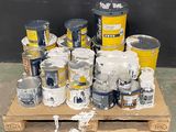 many cans of paint sitting on a pallet