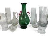 a lot of different glass vases and vases on the table