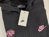 a black hoodie with a pink nike logo on it