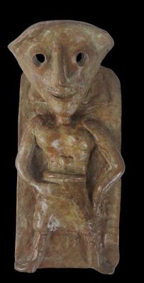 an image of a statue of a man holding a baby