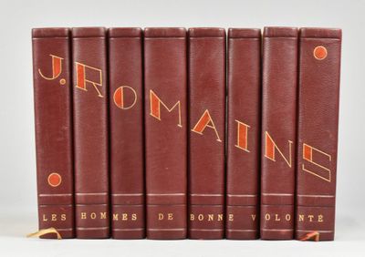 six books in red leather covers with orange lettering on them