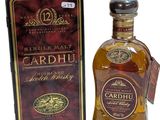 une photo d'une bouteille de whisky Cardhu à côté d'une boîte