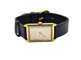 a close up of a watch on a black leather strap