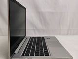 an open laptop computer sitting on top of a white table