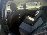 the back seat of a car with the sun shining through the window