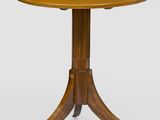 une table ronde avec un plateau et un piètement en bois