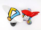 a colorful object on a white surface that looks like a plane