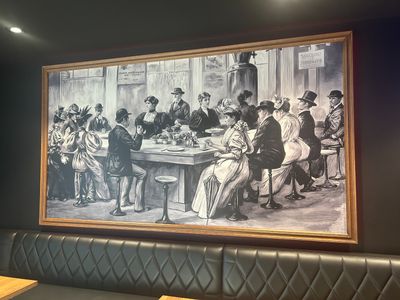 a picture of a painting on the wall of a restaurant