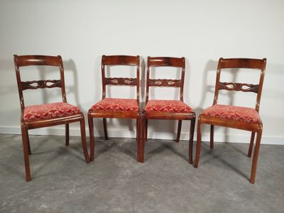 Suite de quatre chaises en acajou et placage d'acajou, dossi…