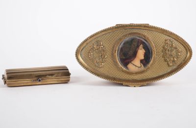 a picture of a woman in a picture on a gold broochle