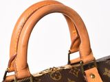 a close up of a brown louis vuitton bag