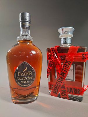 a bottle of liquor next to a bottle of liquor on a table