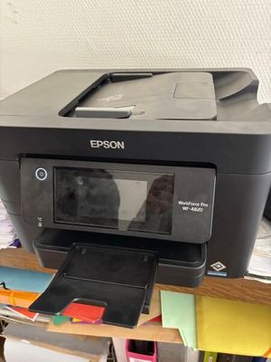 a printer that is sitting on top of a desk