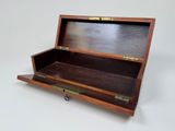 a small wooden box with a handle on it