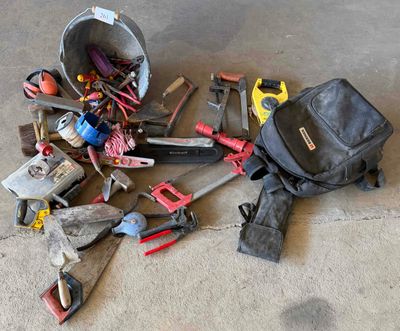 a bucket full of tools on the floor next to a bucket