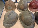 many hats that are sitting on a table