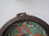 a picture of a small bowl with a bird on it