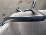 a close up of a seat with a handle on it