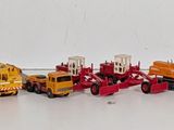 a lot of toy cars that are lined up on the wall