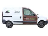 a white van with a brown trim parked on the side of the road