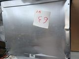 a metal door with a sticker on it in a room