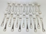 a lot of forks and spoons on the table
