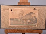 a picture of a painting on an easel with a bird flying over it