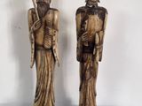 paire de figurines en bois sculpté représentant un homme et une femme