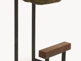 a small stool with a wooden seat next to a small table