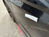 a sticker on the side of a black car