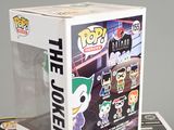 batman the joker pop vinyl figure in a box on a table