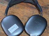 an image of a pair of headphones sitting on top of a wooden floor