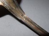 a close up of a spoon on a table