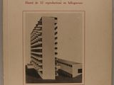 an old book with a picture of a tall building on the cover