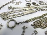 many different chains and bracelets that are on the table