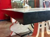 a table that has a glass top on it in a room