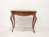 an image of a small table with a wooden top on a white floor