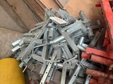 many pieces of metal that are sitting on the floor