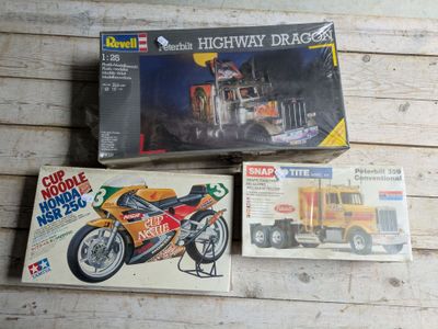 a box with a picture of a motorcycle and a box with a picture of a truck