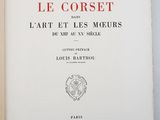 an open book with a red and black title on it
