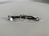 pair of glasses on a table with a white background